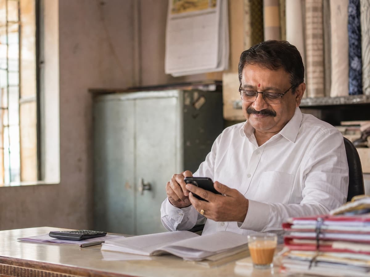 Business client paying an invoice by UPI from his office